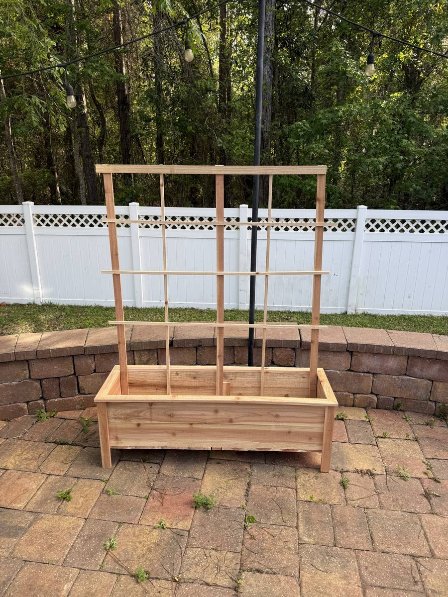 46-inch cedar raised planter box with matching cedar grid trellis attached to the back — great for tomatoes and climbing plants