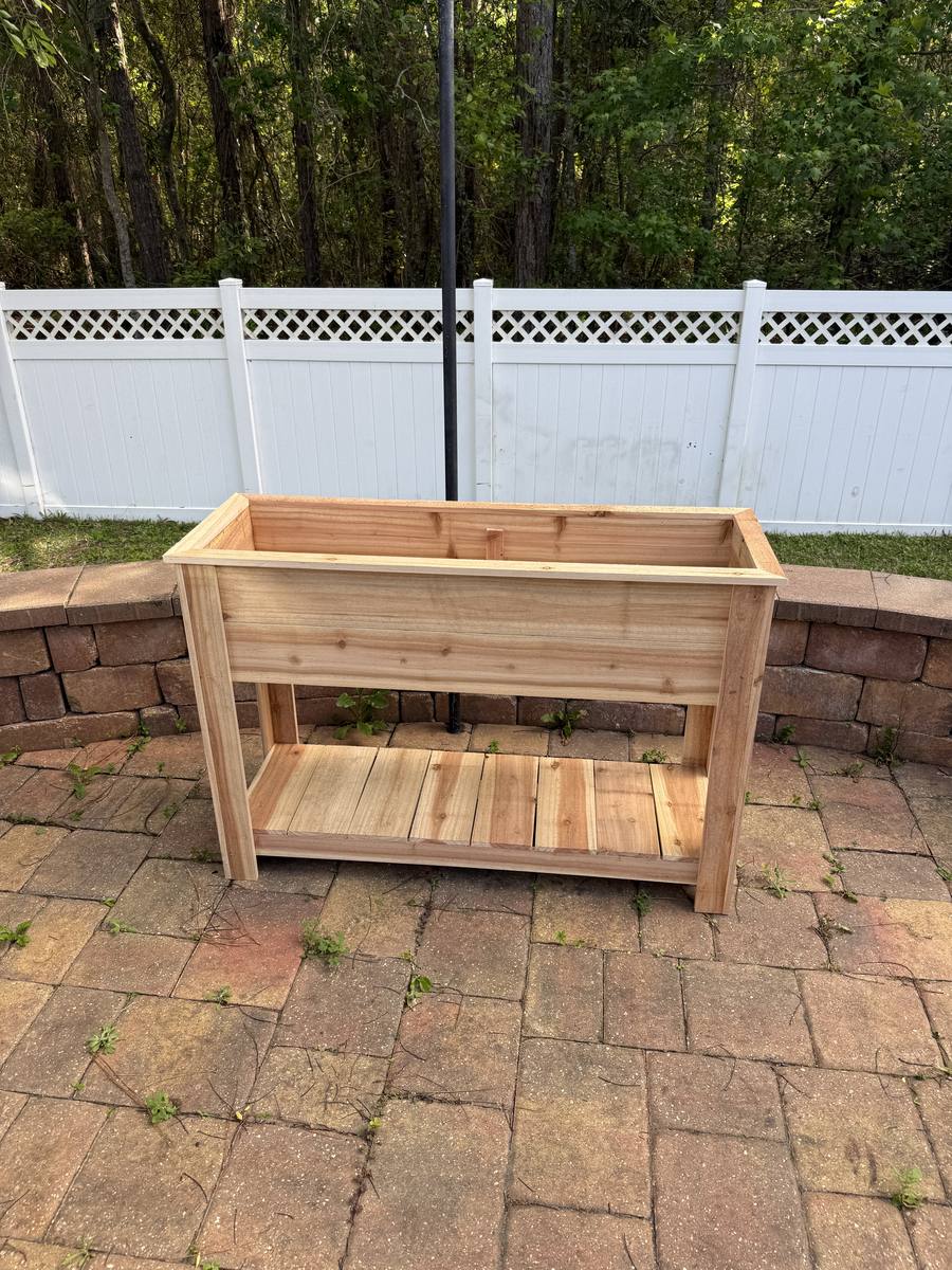 46-inch raised cedar planter box with lower storage shelf — standing height garden bed