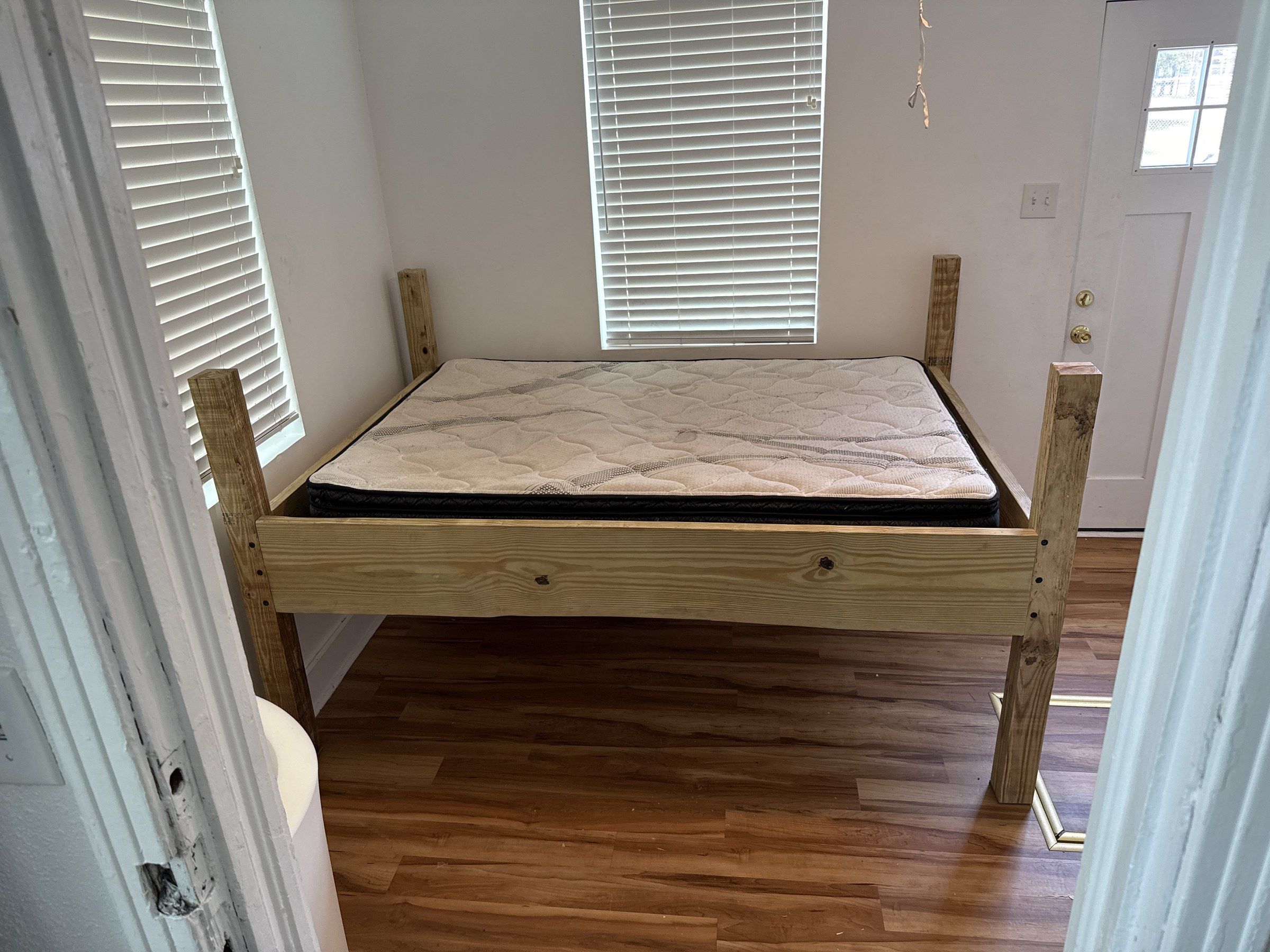 Custom 4-post bed frame built and installed with mattress