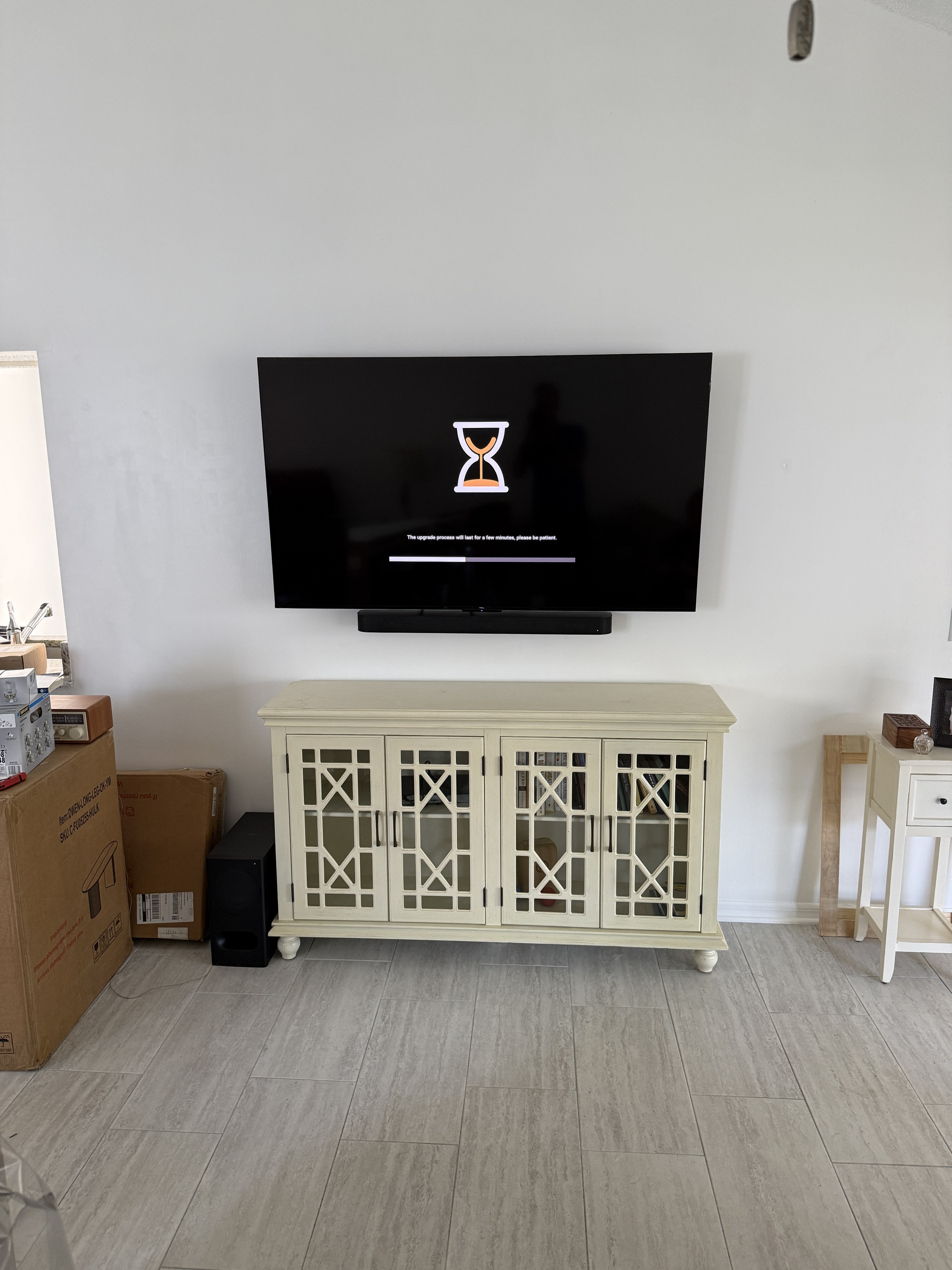 TV cleanly wall-mounted above entertainment console — TV mounting by Rent-A Fella