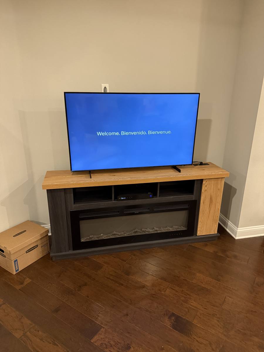 TV stand with electric fireplace assembled — furniture assembly by Rent-A Fella