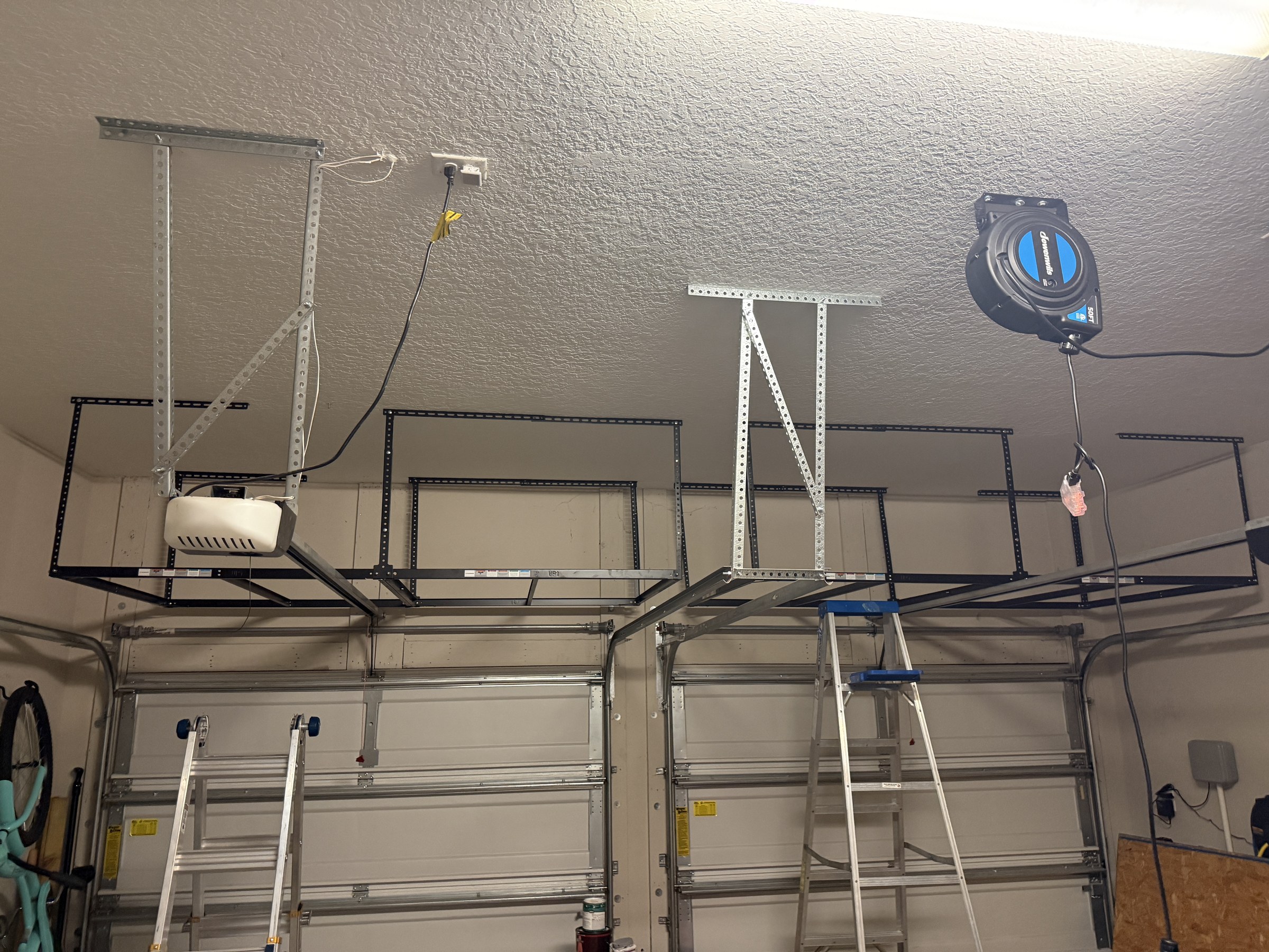 Ceiling-mounted overhead garage storage rack installed by Rent-A Fella in Jacksonville FL