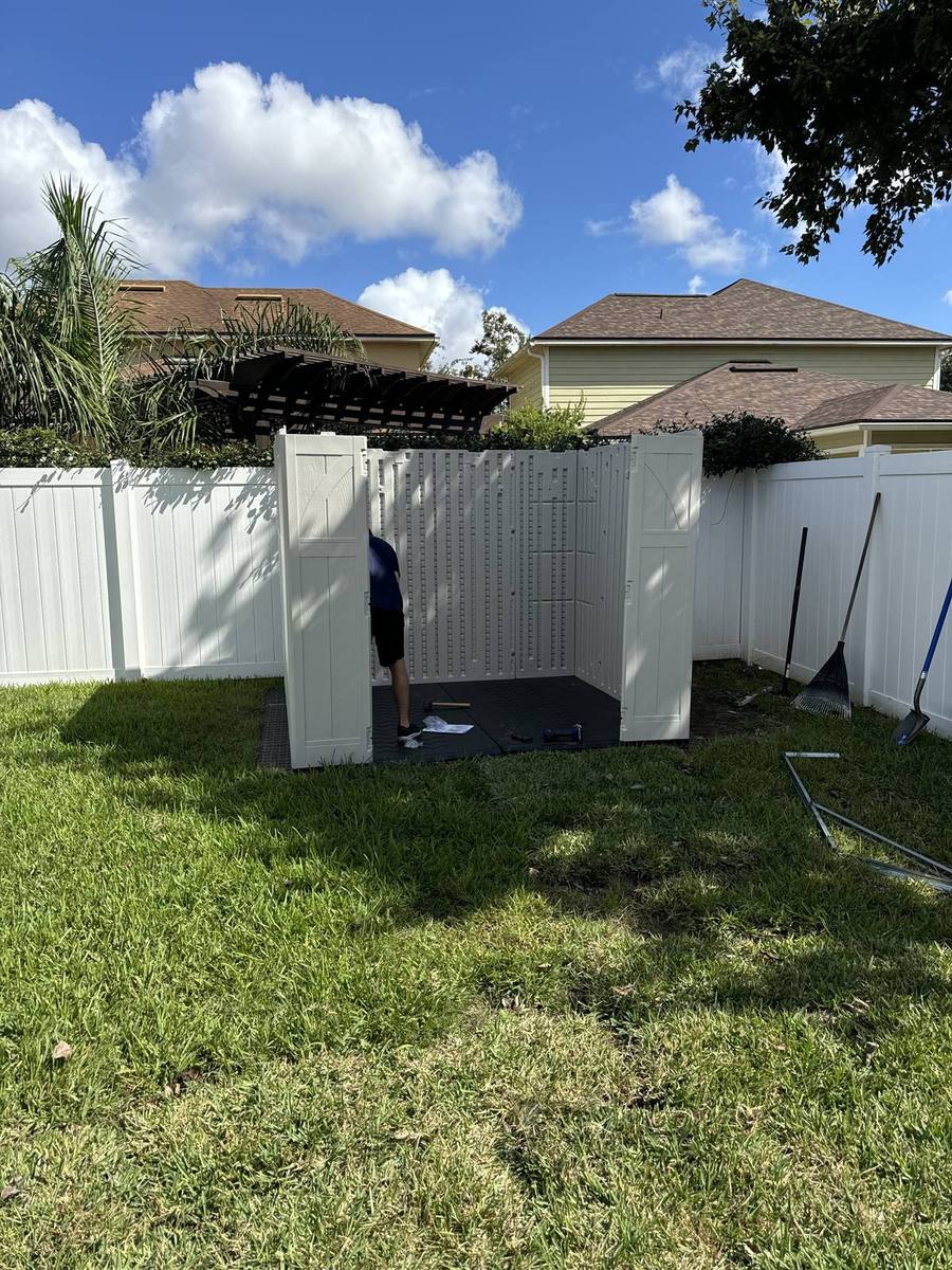 Shed assembly in progress — walls going up