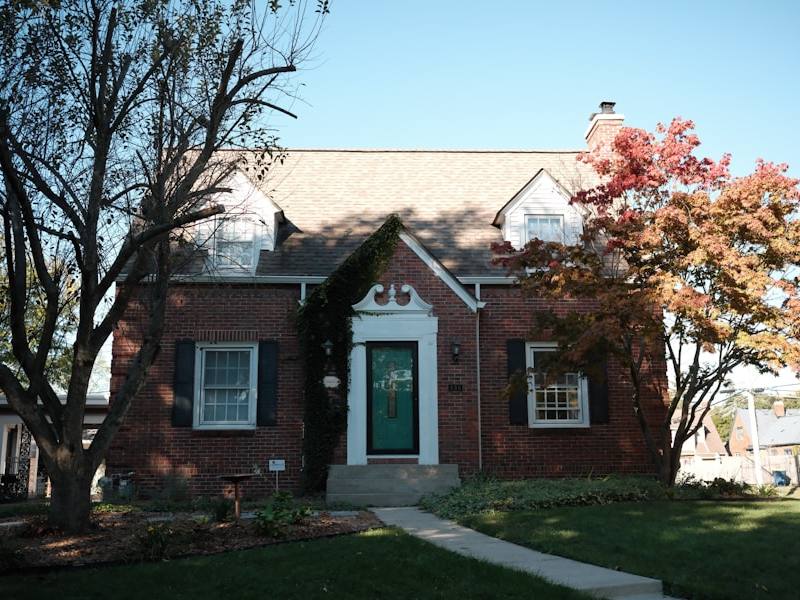 Brick house with green lawn — real estate prep and pre-listing repairs